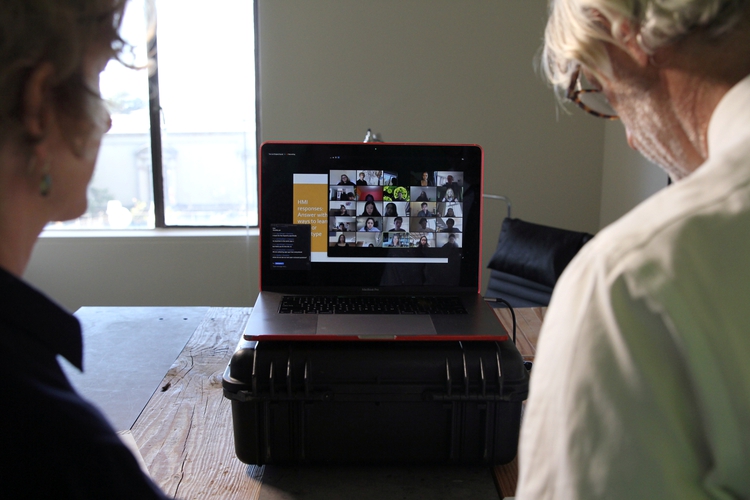 University of California, Berkeley Professors Lisa Wymore (L) and Greg Niemeyer look at the Zoom screen showing students in their online Collaborative Innovation course in Berkeley, California, U.S., March 12, 2020. REUTERS/Nathan Frandino